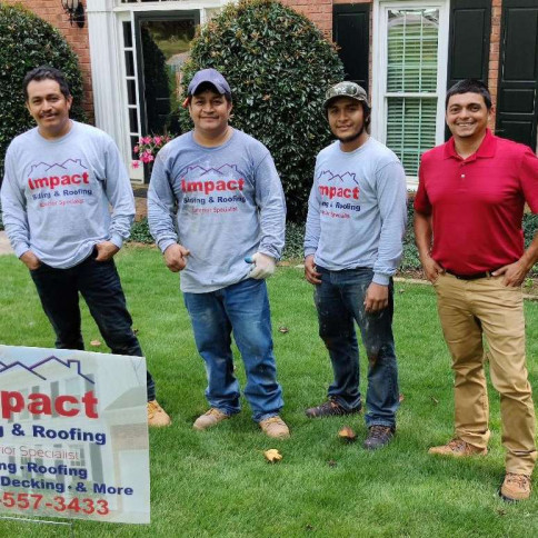 The Impact Siding and Roofing crew on a Dallas, GA lawn